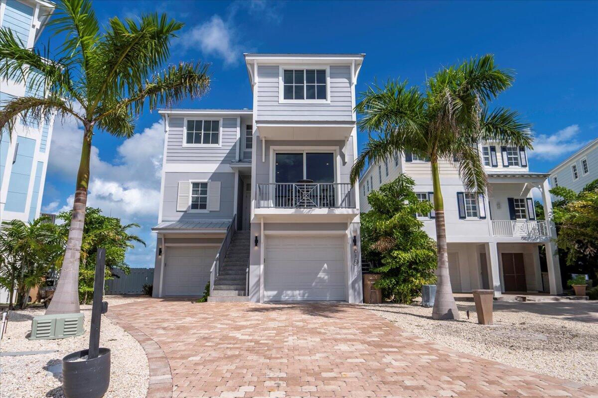 810 39th Street, Unit GULF Marathon, FL 33050 - Photo 2 of 113 a house with palm tree in front of it