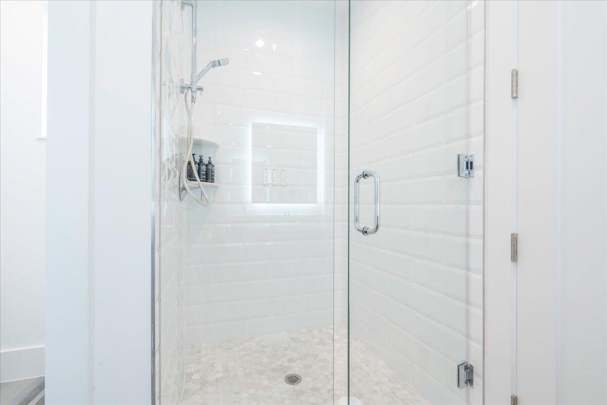 810 39th Street, Unit GULF Marathon, FL 33050 - Photo 40 of 113 a bathroom with a glass shower door