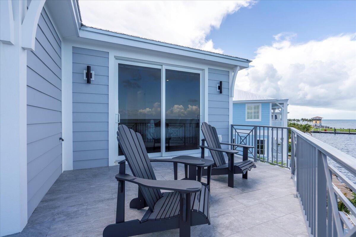 810 39th Street, Unit GULF Marathon, FL 33050 - Photo 50 of 113 a view of a patio with a chairs and table in a patio