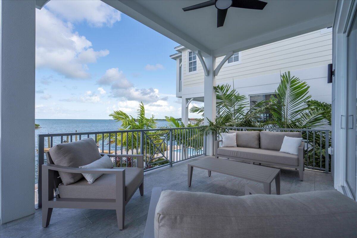 810 39th Street, Unit GULF Marathon, FL 33050 - Photo 54 of 113 a balcony with furniture and a potted plant