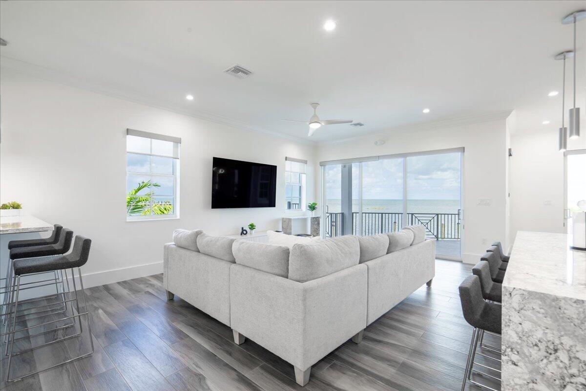 810 39th Street, Unit GULF Marathon, FL 33050 - Photo 6 of 113 a living room with furniture and a flat screen tv