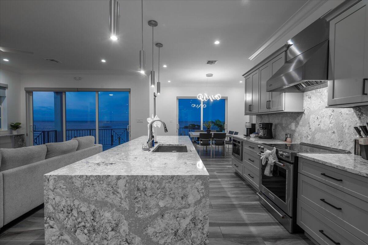 810 39th Street, Unit GULF Marathon, FL 33050 - Photo 81 of 113 a large kitchen with stainless steel appliances granite countertop a large counter top a stove a sink and a refrigerator