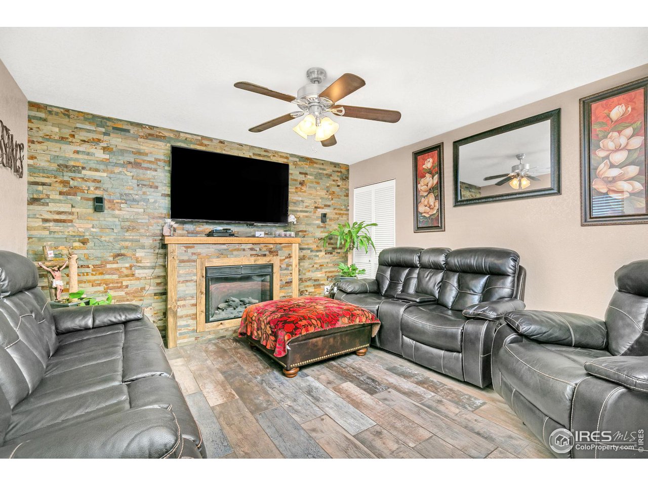3704 Riverside Parkway Evans, CO 80620 - Photo 6 of 25 Custom stone accent wall w/ gas fireplace