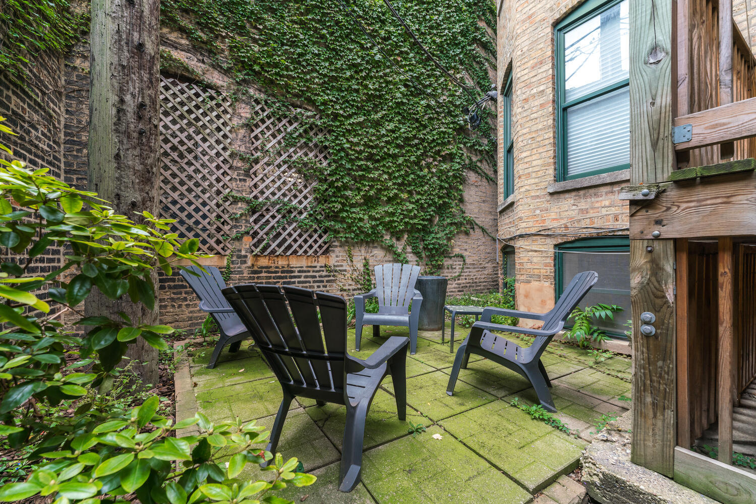 4633 North Racine Avenue, Unit GN Chicago, IL 60640 - Photo 18 of 25 a view of an outdoor sitting area with brick wall