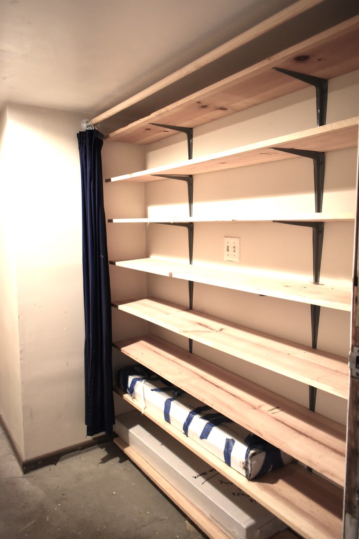 4633 North Racine Avenue, Unit GN Chicago, IL 60640 - Photo 20 of 25 a view of a room with rack on the wall