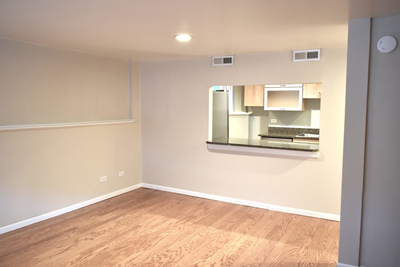 4633 North Racine Avenue, Unit GN Chicago, IL 60640 - Photo 6 of 25 a view of kitchen and wooden floor