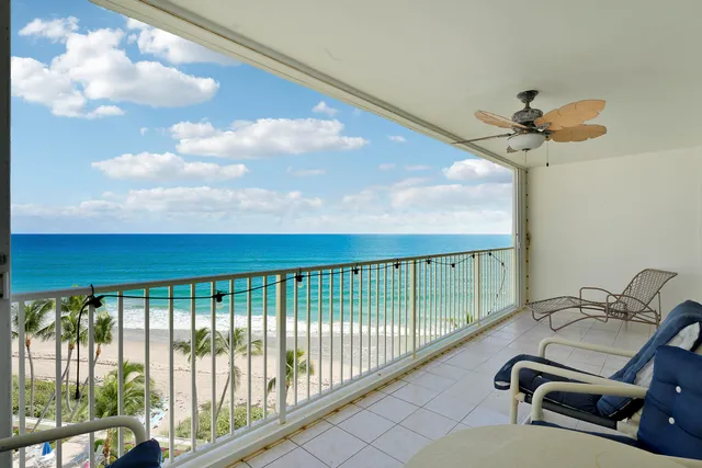 a view of a balcony with a ceiling fan