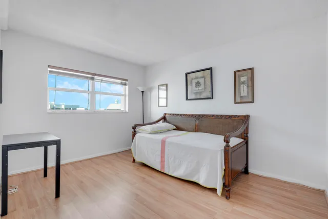 a room with a bed and a window