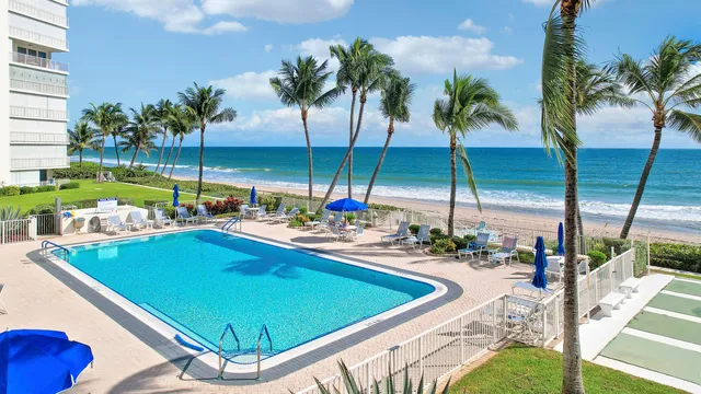 a view of swimming pool with outdoor seating