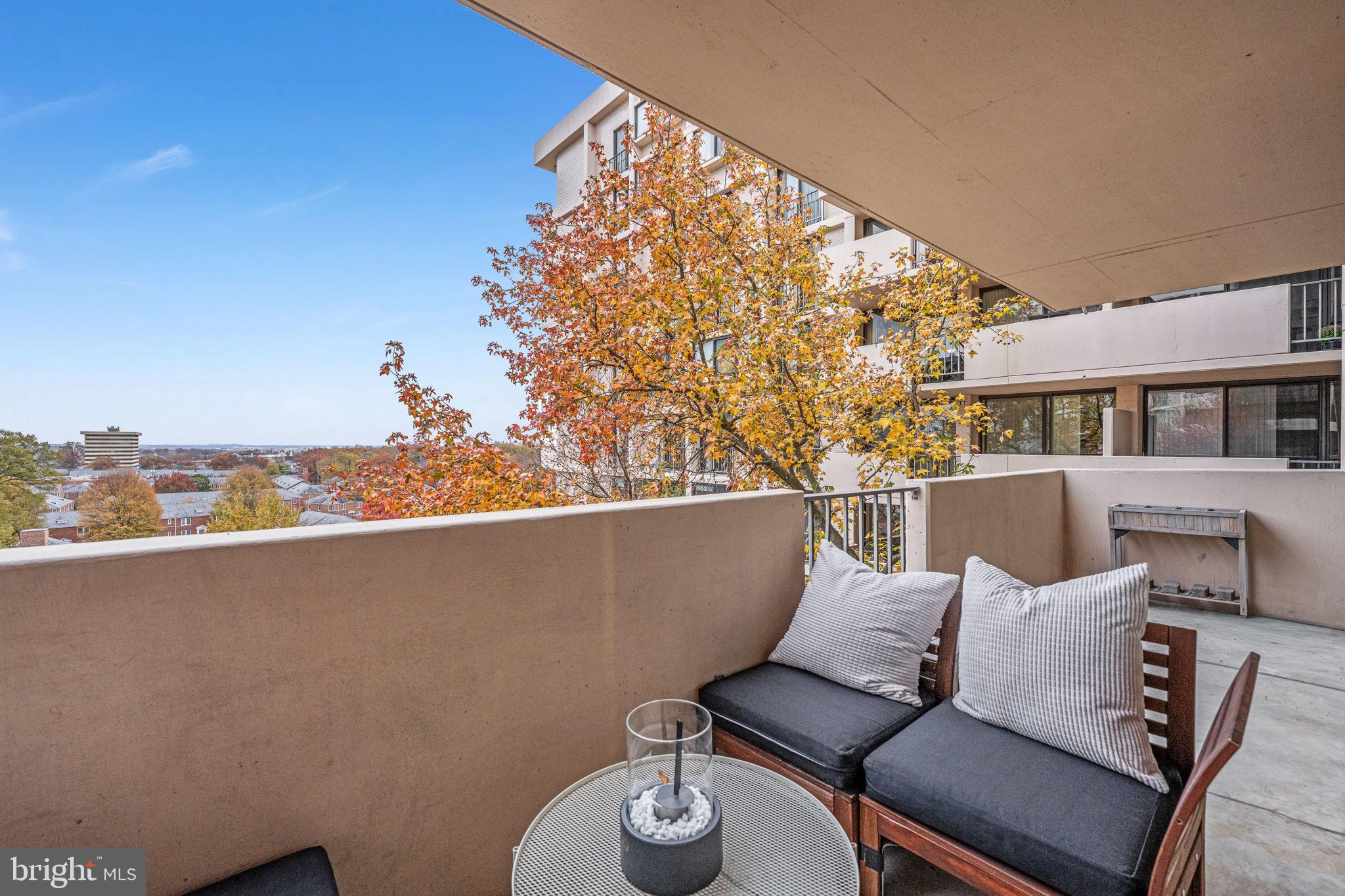 4141 North Henderson Road, Unit 702 Arlington, VA 22203 - Photo 26 of 69 a view of a chairs and table in a balcony