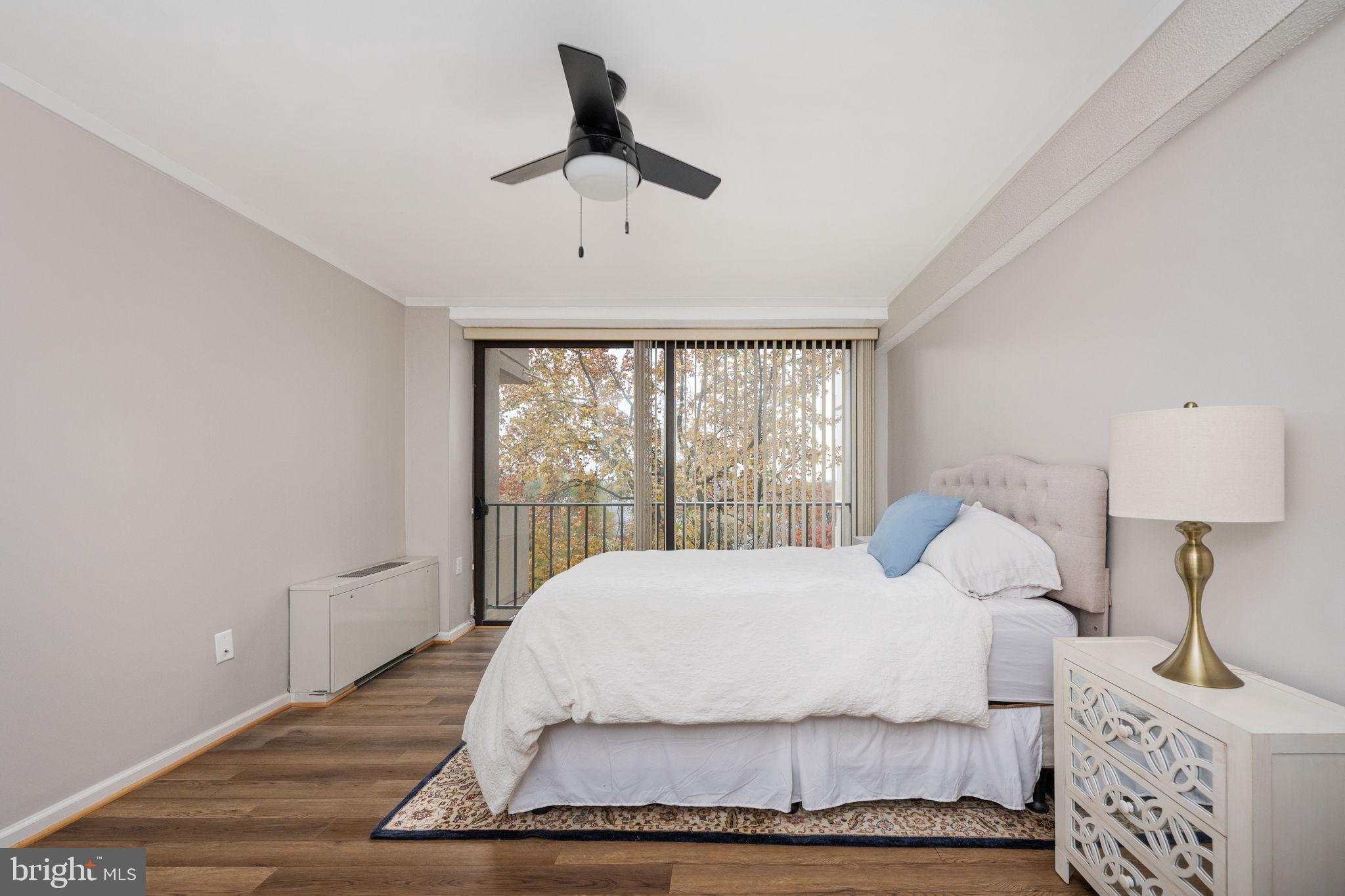 4141 North Henderson Road, Unit 702 Arlington, VA 22203 - Photo 32 of 69 a bedroom with a large bed and a window