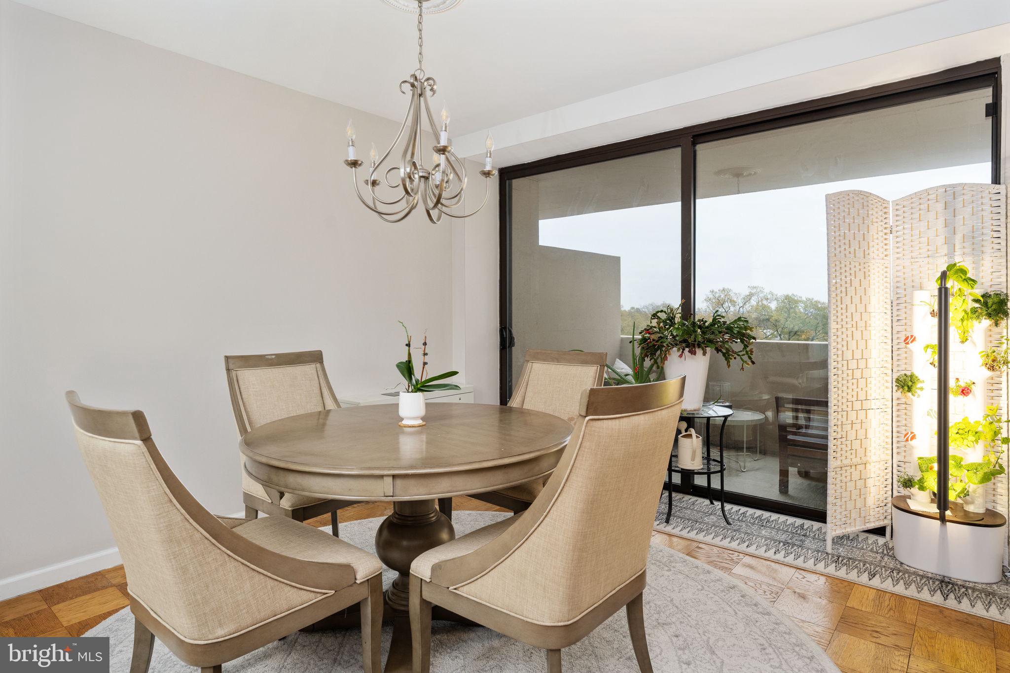 4141 North Henderson Road, Unit 702 Arlington, VA 22203 - Photo 4 of 69 a view of a dining room with furniture window and wooden floor