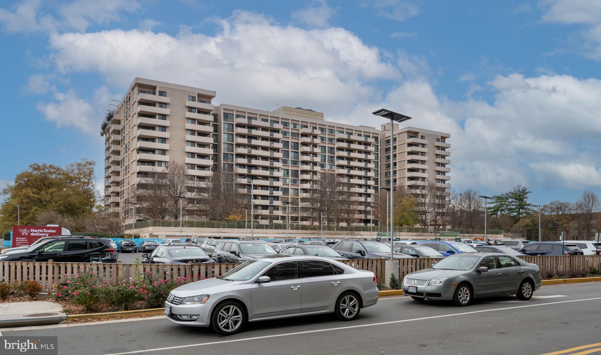 4141 North Henderson Road, Unit 702 Arlington, VA 22203 - Photo 62 of 69 a view of parking with a cars parked in front of it