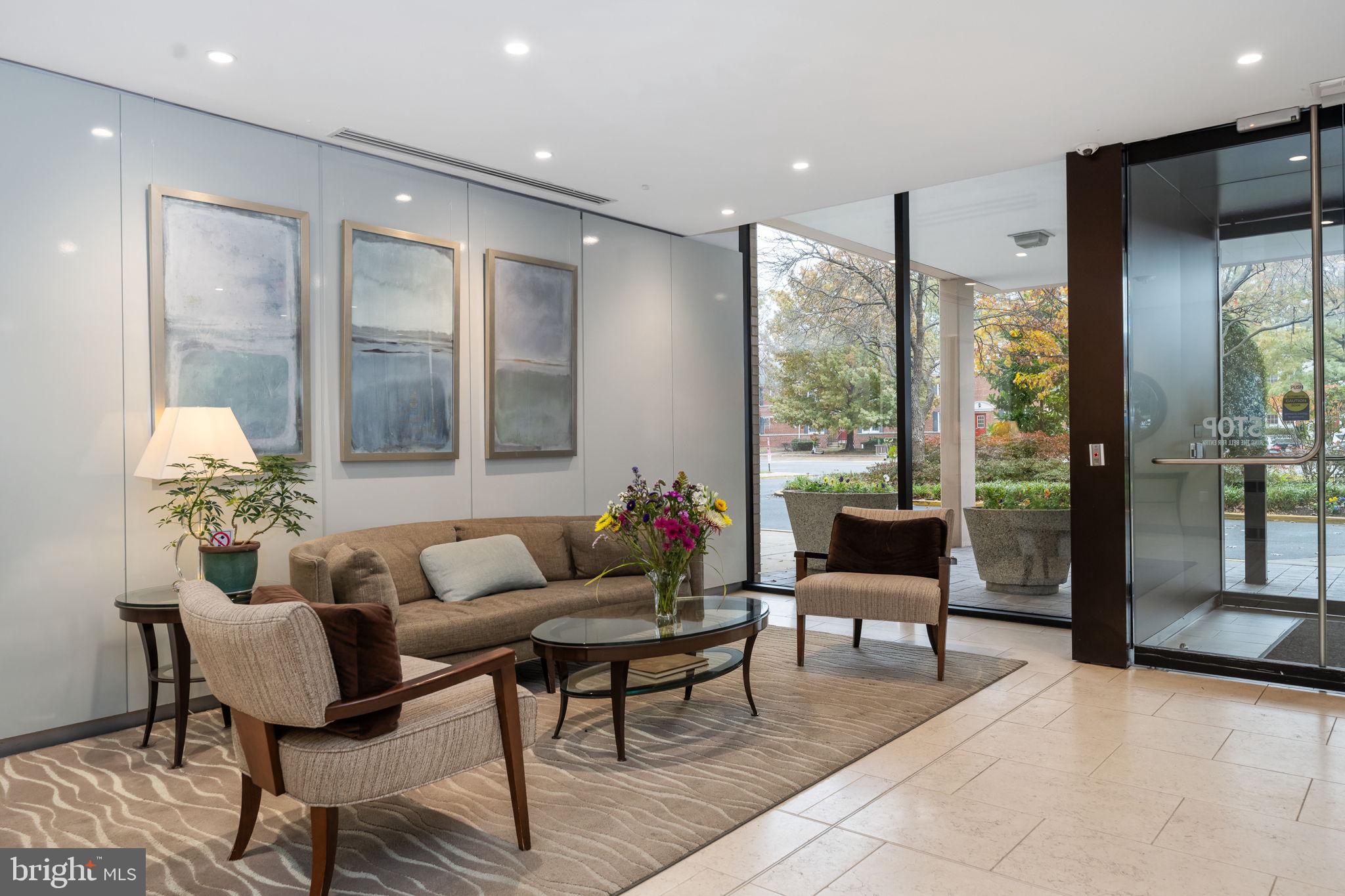 4141 North Henderson Road, Unit 702 Arlington, VA 22203 - Photo 8 of 69 a living room with furniture and a large window
