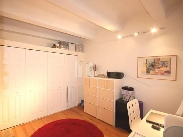 a bedroom with a bed and furniture