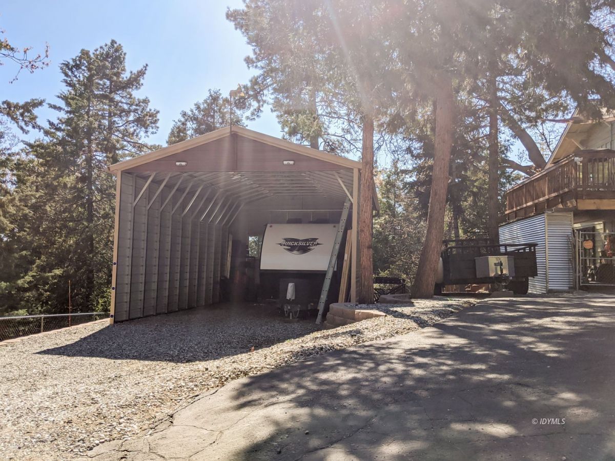 26523 Pine Avenue Idyllwild, CA 92549 - Photo 11 of 56 a front view of a house with a yard