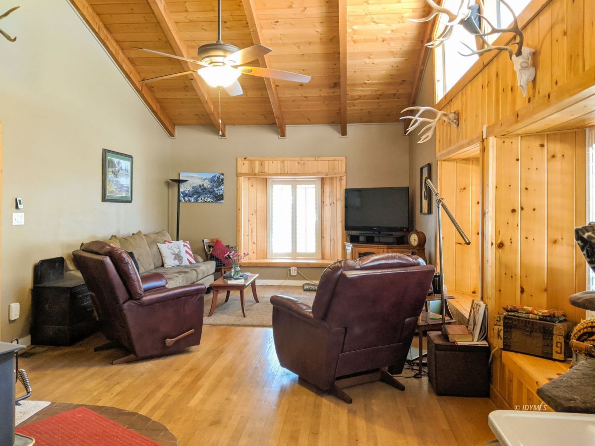 26523 Pine Avenue Idyllwild, CA 92549 - Photo 16 of 56 a living room with furniture ceiling fan and a rug