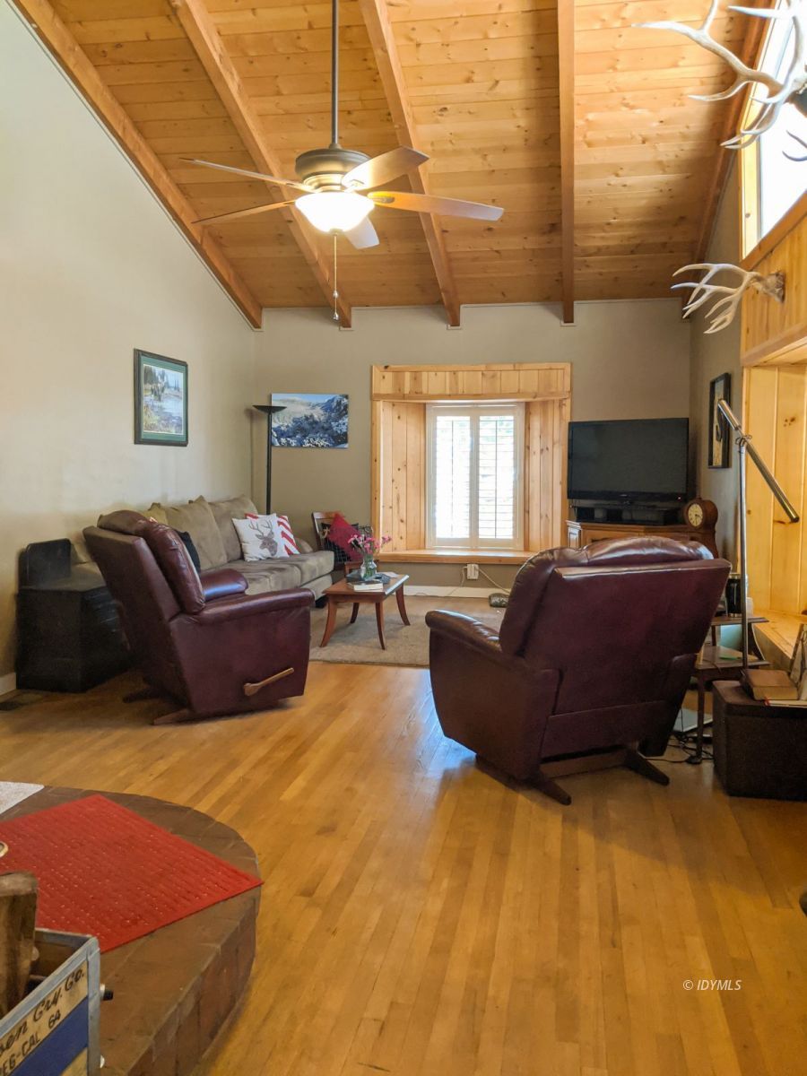 26523 Pine Avenue Idyllwild, CA 92549 - Photo 17 of 56 a living room with furniture and a flat screen tv