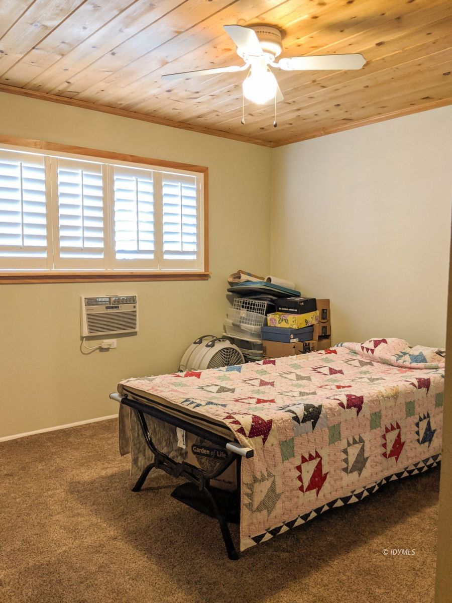 26523 Pine Avenue Idyllwild, CA 92549 - Photo 20 of 56 a bedroom with a bed and a window