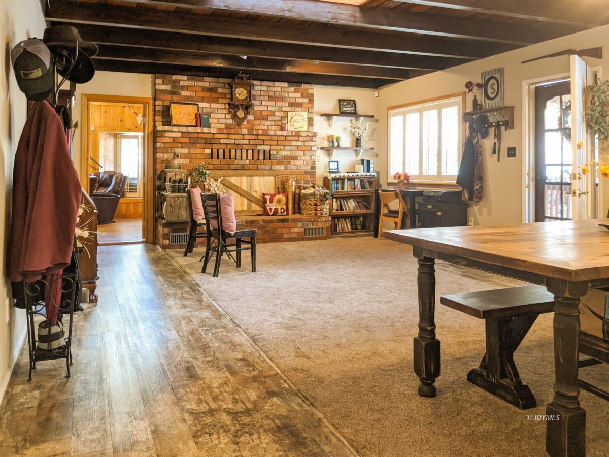 26523 Pine Avenue Idyllwild, CA 92549 - Photo 2 of 56 a room with lots of wooden furniture and a table