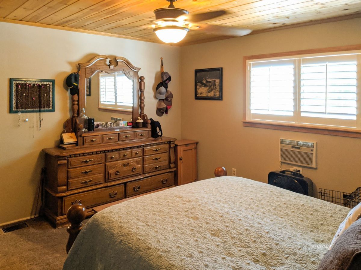 26523 Pine Avenue Idyllwild, CA 92549 - Photo 21 of 56 a bedroom with a bed and a dresser