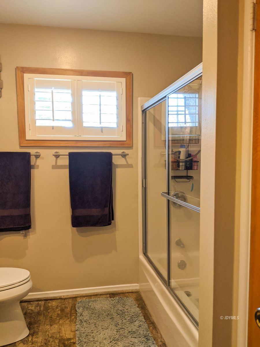 26523 Pine Avenue Idyllwild, CA 92549 - Photo 23 of 56 a bathroom with a toilet and a shower
