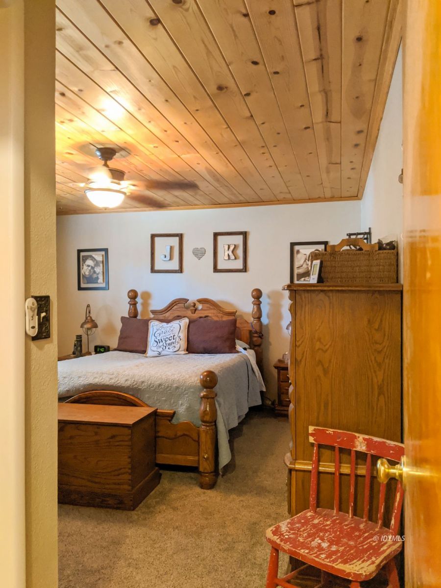26523 Pine Avenue Idyllwild, CA 92549 - Photo 25 of 56 a bed room with a bed and a couch