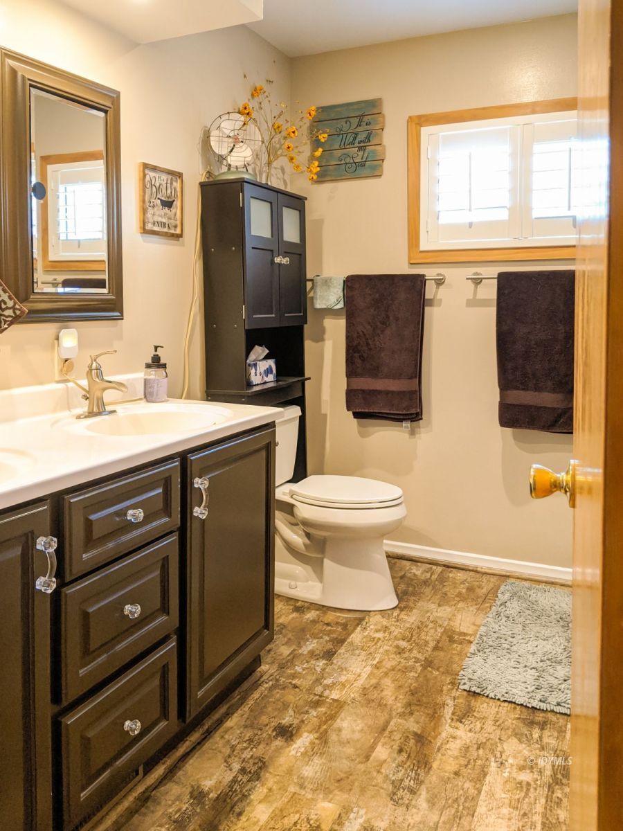 26523 Pine Avenue Idyllwild, CA 92549 - Photo 26 of 56 a bathroom with a sink toilet and mirror