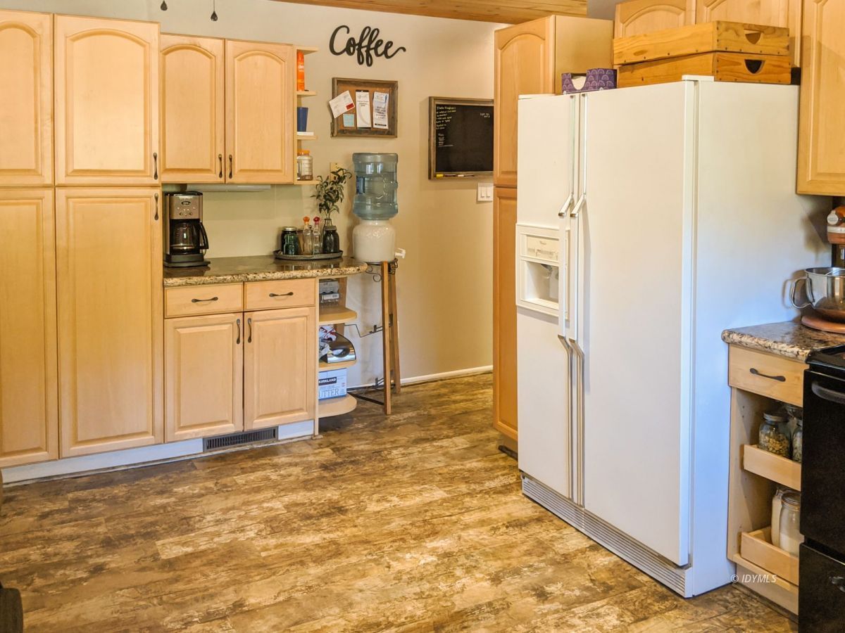 26523 Pine Avenue Idyllwild, CA 92549 - Photo 29 of 56 a kitchen with stainless steel appliances a refrigerator sink and cabinets