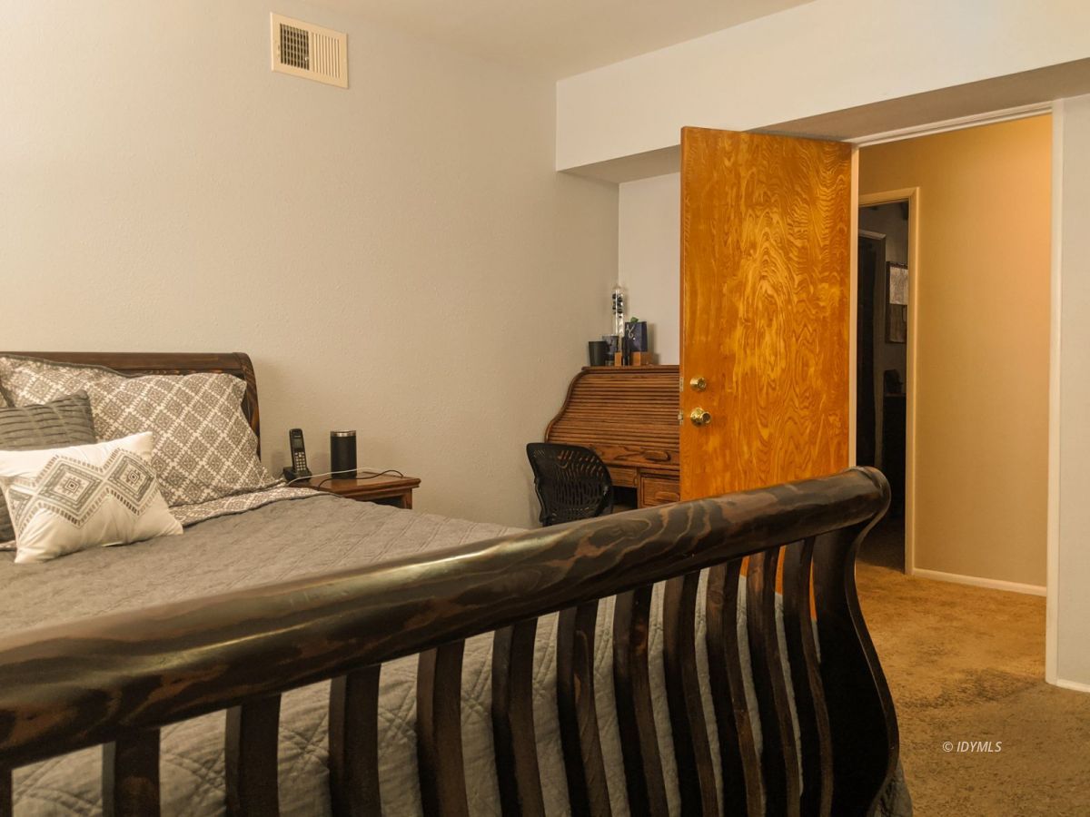 26523 Pine Avenue Idyllwild, CA 92549 - Photo 44 of 56 a bedroom with a bed and wooden floor