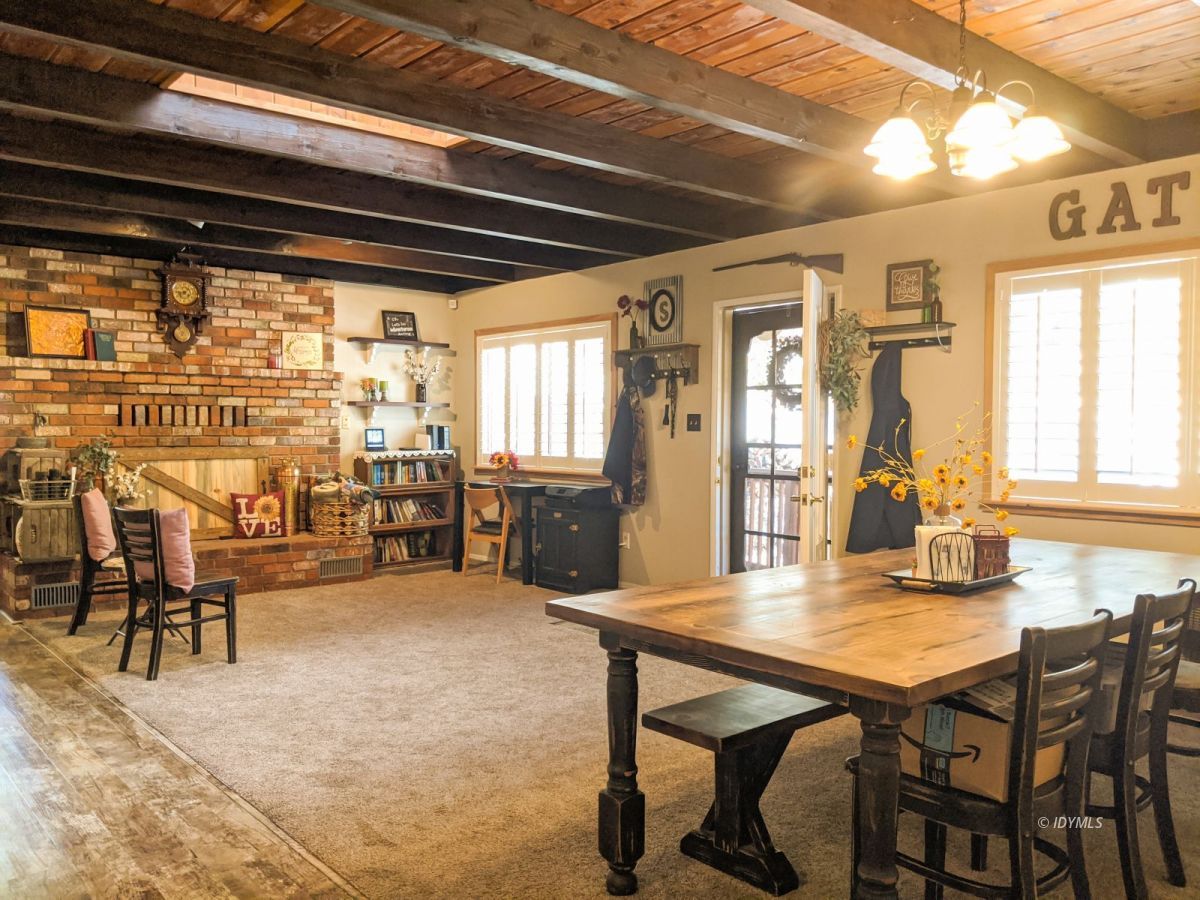 26523 Pine Avenue Idyllwild, CA 92549 - Photo 7 of 56 a view of a dining room with furniture and a table