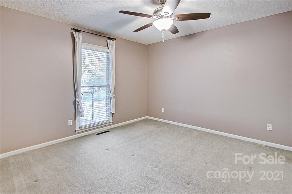 928 Meadowbrook Road Asheboro, NC 27203 - Photo 13 of 25 an empty room with windows and fan