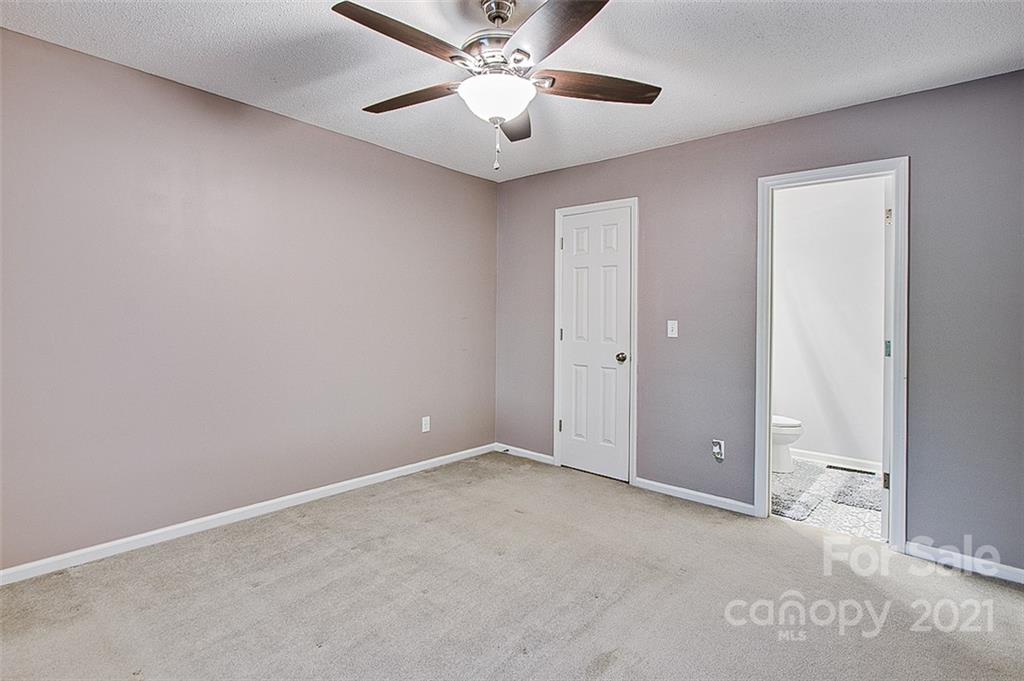 928 Meadowbrook Road Asheboro, NC 27203 - Photo 14 of 25 a view of an empty room and a ceiling fan