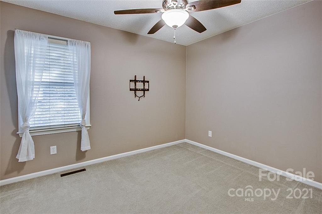 928 Meadowbrook Road Asheboro, NC 27203 - Photo 17 of 25 an empty room with windows and fan