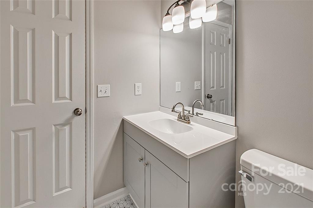 928 Meadowbrook Road Asheboro, NC 27203 - Photo 18 of 25 a bathroom with a sink vanity and a mirror