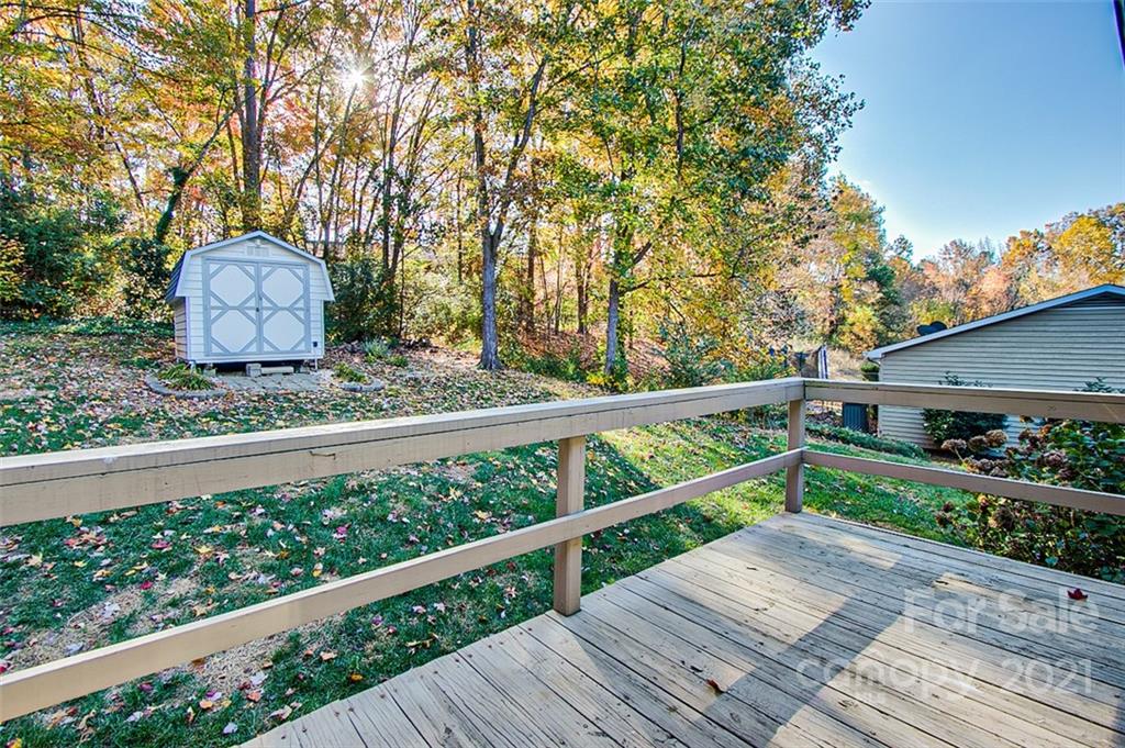 928 Meadowbrook Road Asheboro, NC 27203 - Photo 23 of 25 a wooden bench sitting in front of a wooden fence