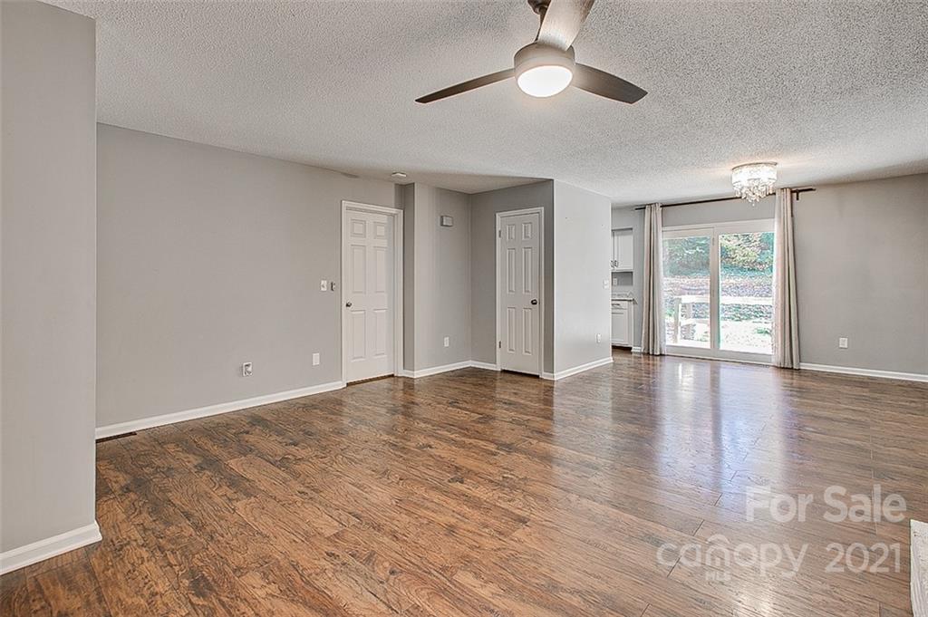 928 Meadowbrook Road Asheboro, NC 27203 - Photo 5 of 25 wooden floor in an empty room with a window