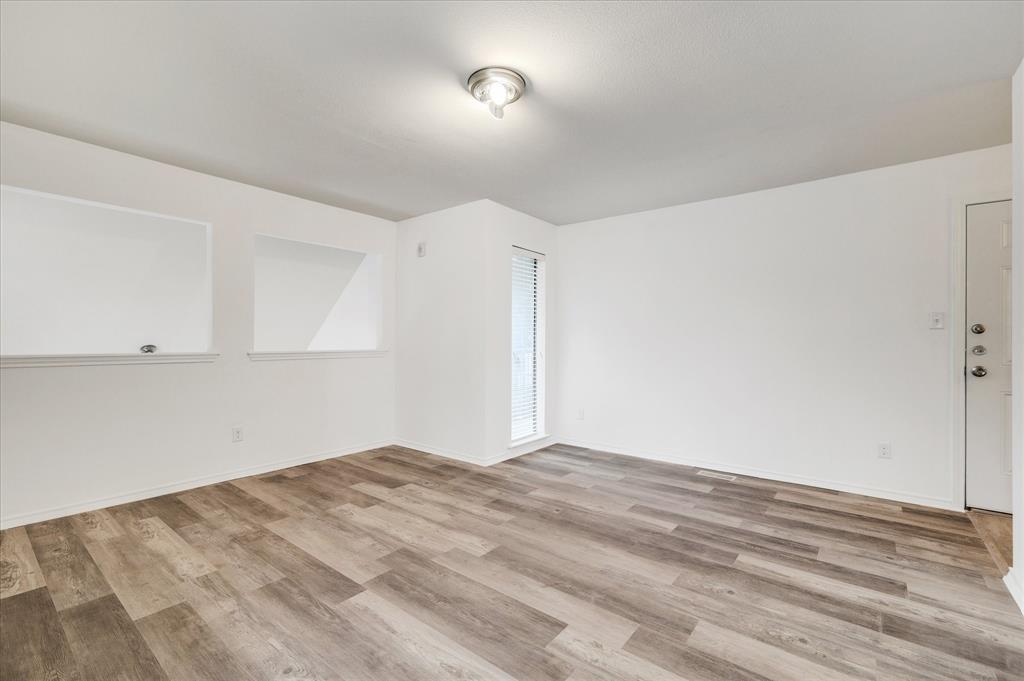 9831 Walnut Street, Unit 212 Dallas, TX 75243 - Photo 18 of 27 Bonus room featuring light hardwood / wood-style floors