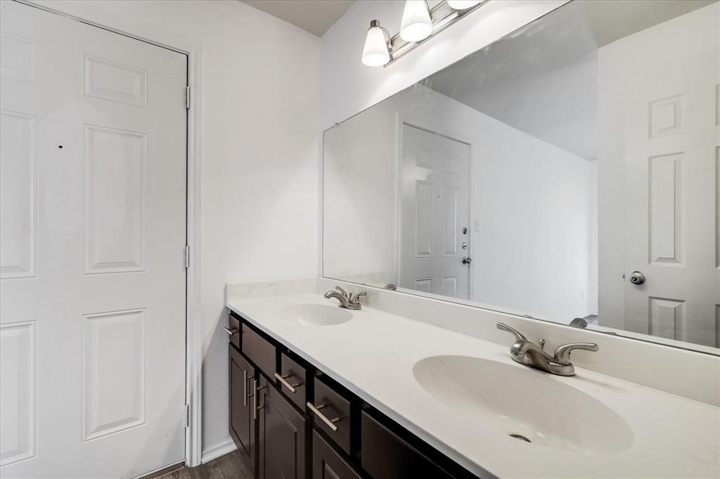 9831 Walnut Street, Unit 212 Dallas, TX 75243 - Photo 22 of 27 Bathroom with vanity and wood-type flooring