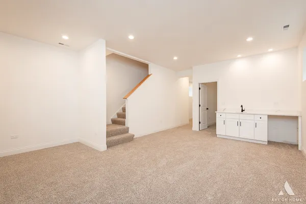 a kitchen with white cabinets