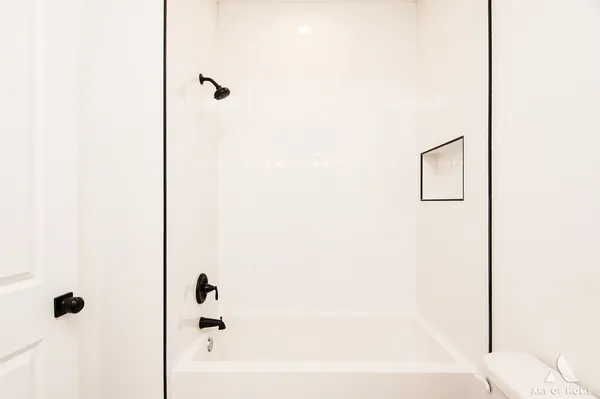 a bathroom with double vanity sinks and a mirror