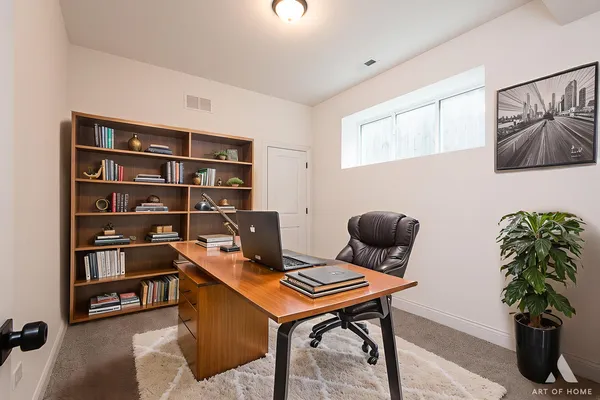 a view of a workspace with furniture