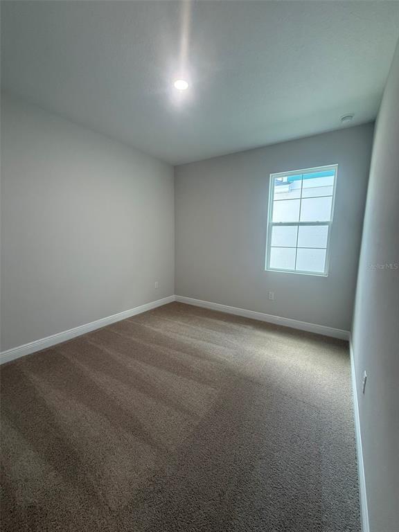 12132 Cattleside Drive Riverview, FL 33579 - Photo 14 of 31 an empty room with a window