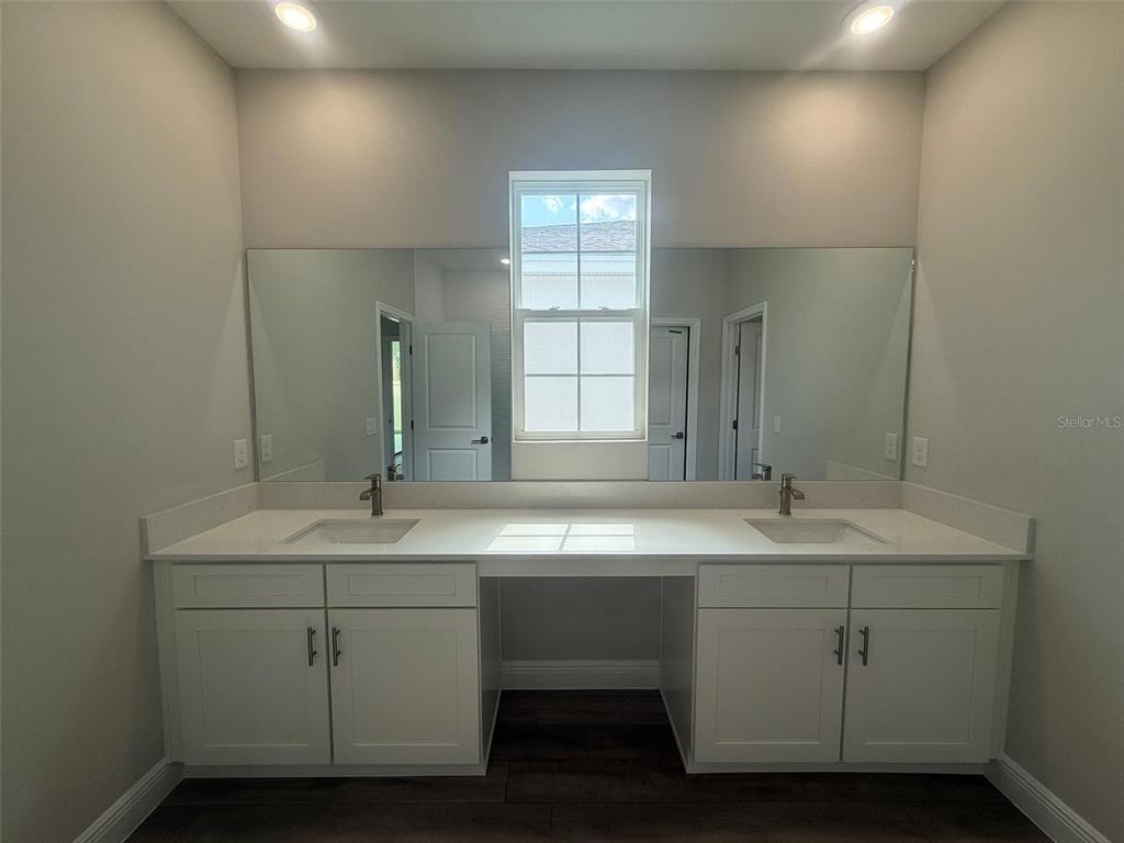 12132 Cattleside Drive Riverview, FL 33579 - Photo 27 of 31 a bathroom with a sink and a mirror