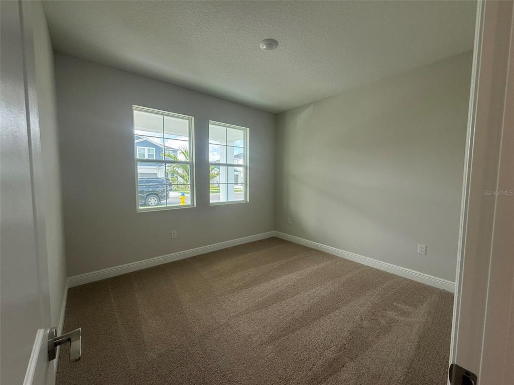 12132 Cattleside Drive Riverview, FL 33579 - Photo 9 of 31 an empty room with windows