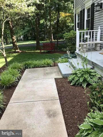 front view of a house with a garden