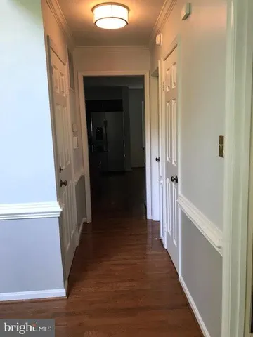 an entryway with wooden floor