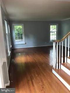 a view of entryway with wooden floor