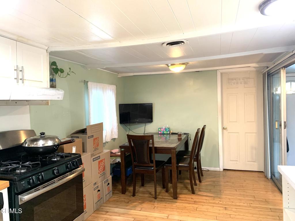 3900 East Main Street, Unit 62 Ventura, CA 93003 - Photo 4 of 11 a view of a dining room with furniture and wooden floor