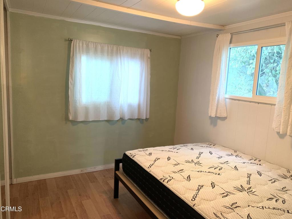 3900 East Main Street, Unit 62 Ventura, CA 93003 - Photo 5 of 11 a view of kitchen with wooden floor and a window